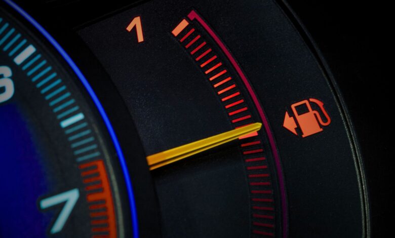Close-up of car speedometer displaying better fuel economy